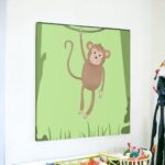 Wall Art: A Monkey Hanging from a Vine in the Jungle